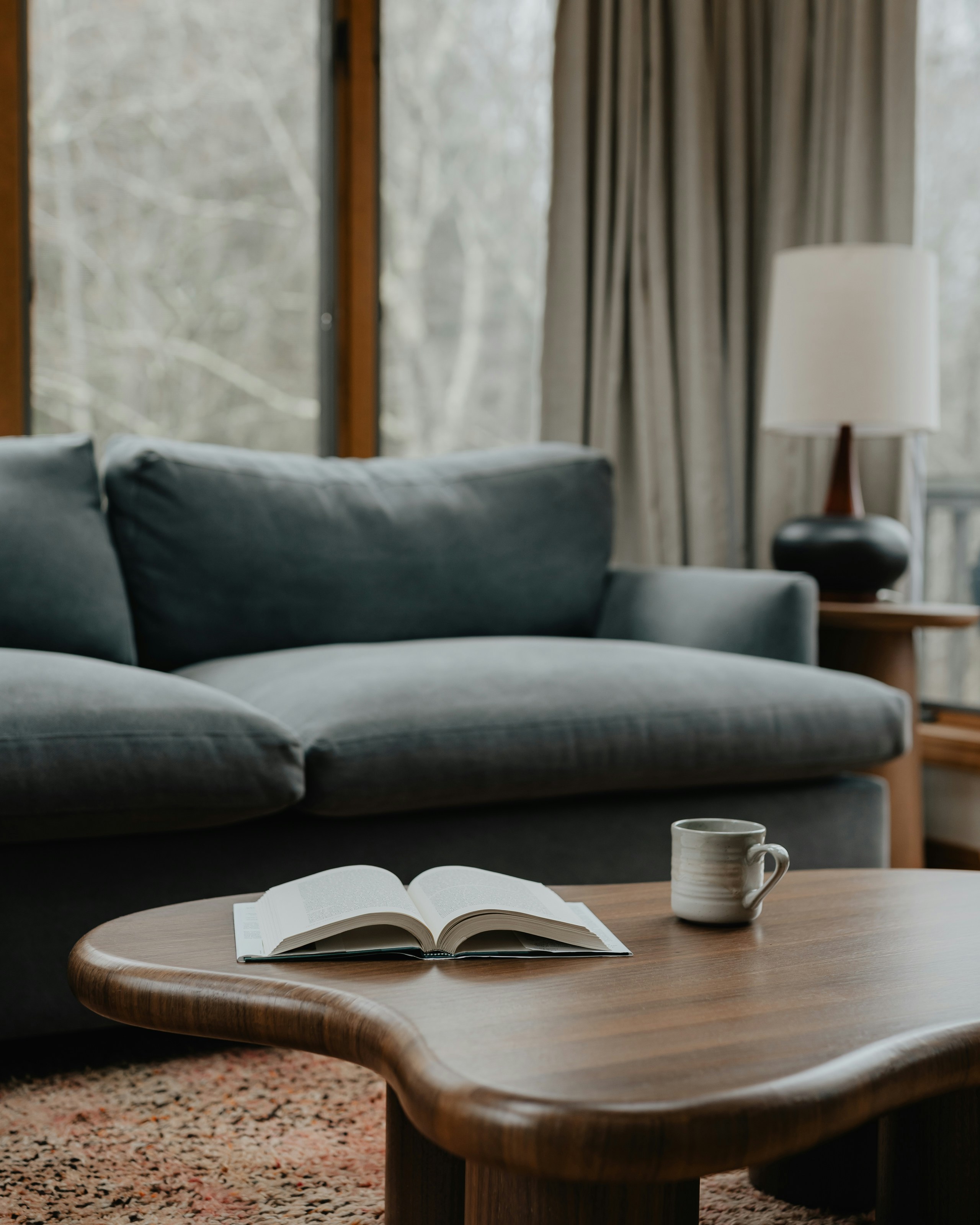 Light coffee table paired with a dark sectional for contrast